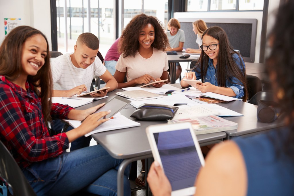 Palmetto Achievers high school students in a study group smiling